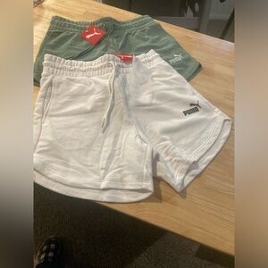 Two pairs of Puma terry shorts in size small. Sold as a lot.1 green & 1 white
